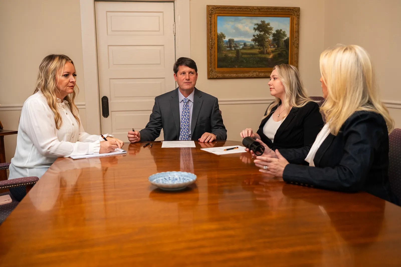 Met Lane and the Met Lane & Associates legal team meeting with a client